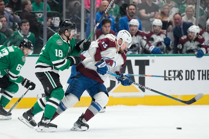 Colorado Avalanche right wing Valeri Nichushkin (13) looks to take control of the puck under...