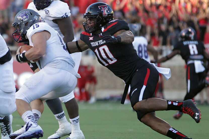 Texas Tech's Pete Robertson takes down Central Arkansas' Taylor Reed during an NCAA college...