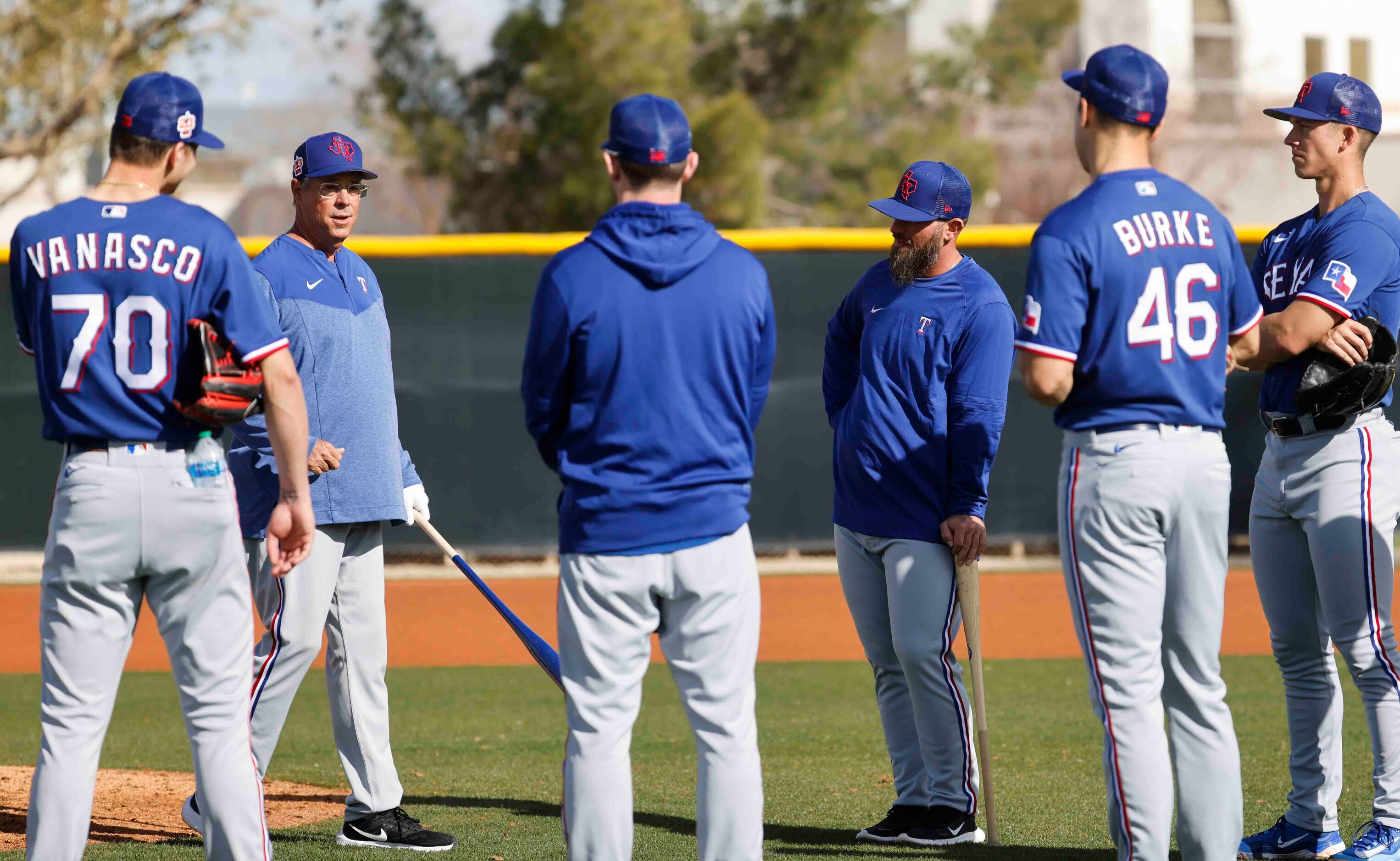 Texas Rangers special assistant Greg Maddux, left, instructs pitchers during a spring...