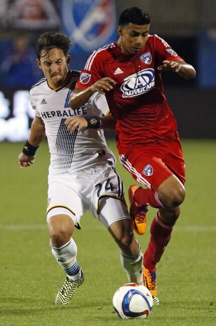 FC Dallas defender Moises Hernandez (3) colides with LA Galaxy defender Stefan Ishizaki (24)...