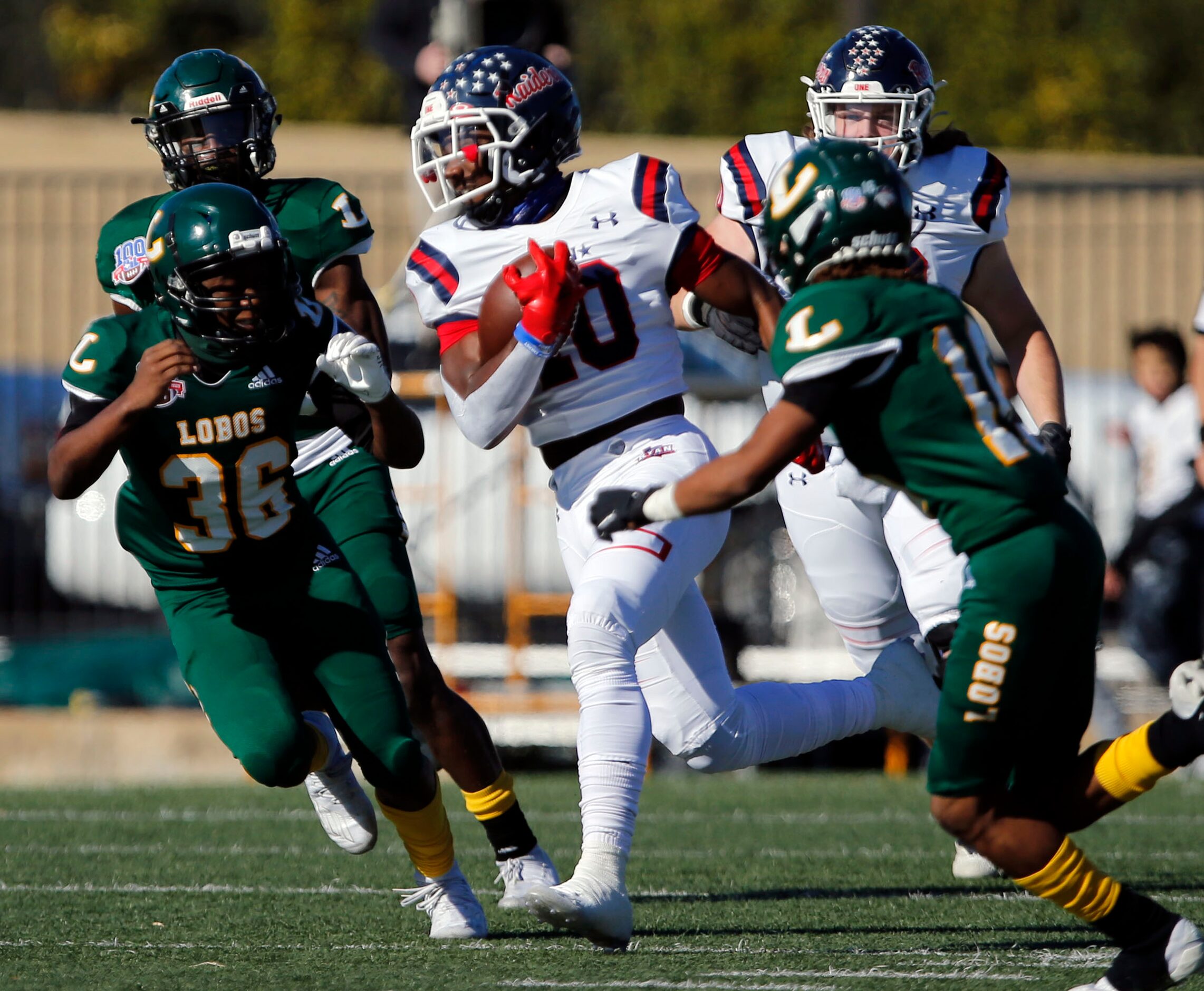 Denton Ryan’s Kalib Hicks (10) breaks through the Longview defense during the first half of...