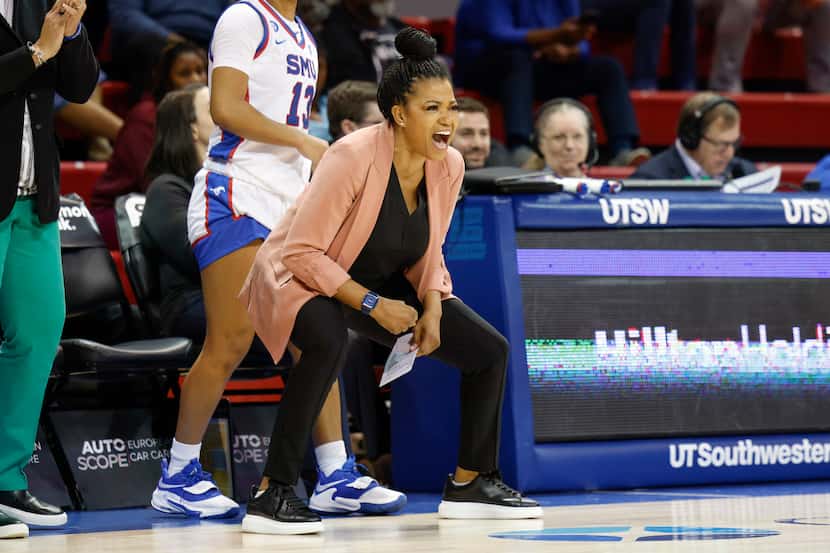 SMU head coach Toyelle Wilson reacts after a three-pointer during the second half of an NCAA...