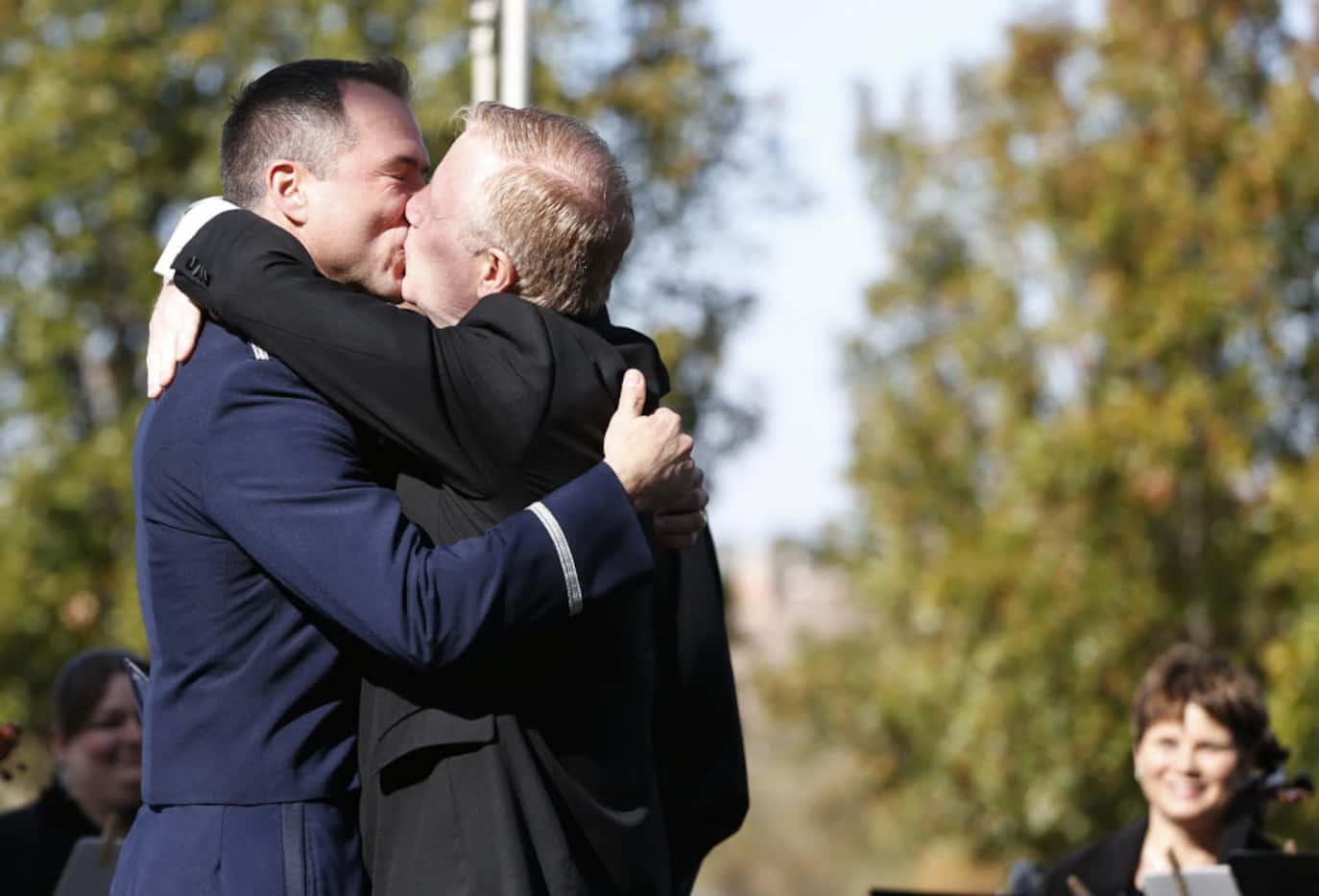Vic Holmes (left) and Mark Phariss kiss after Charlie Gonzalez announced they were married...