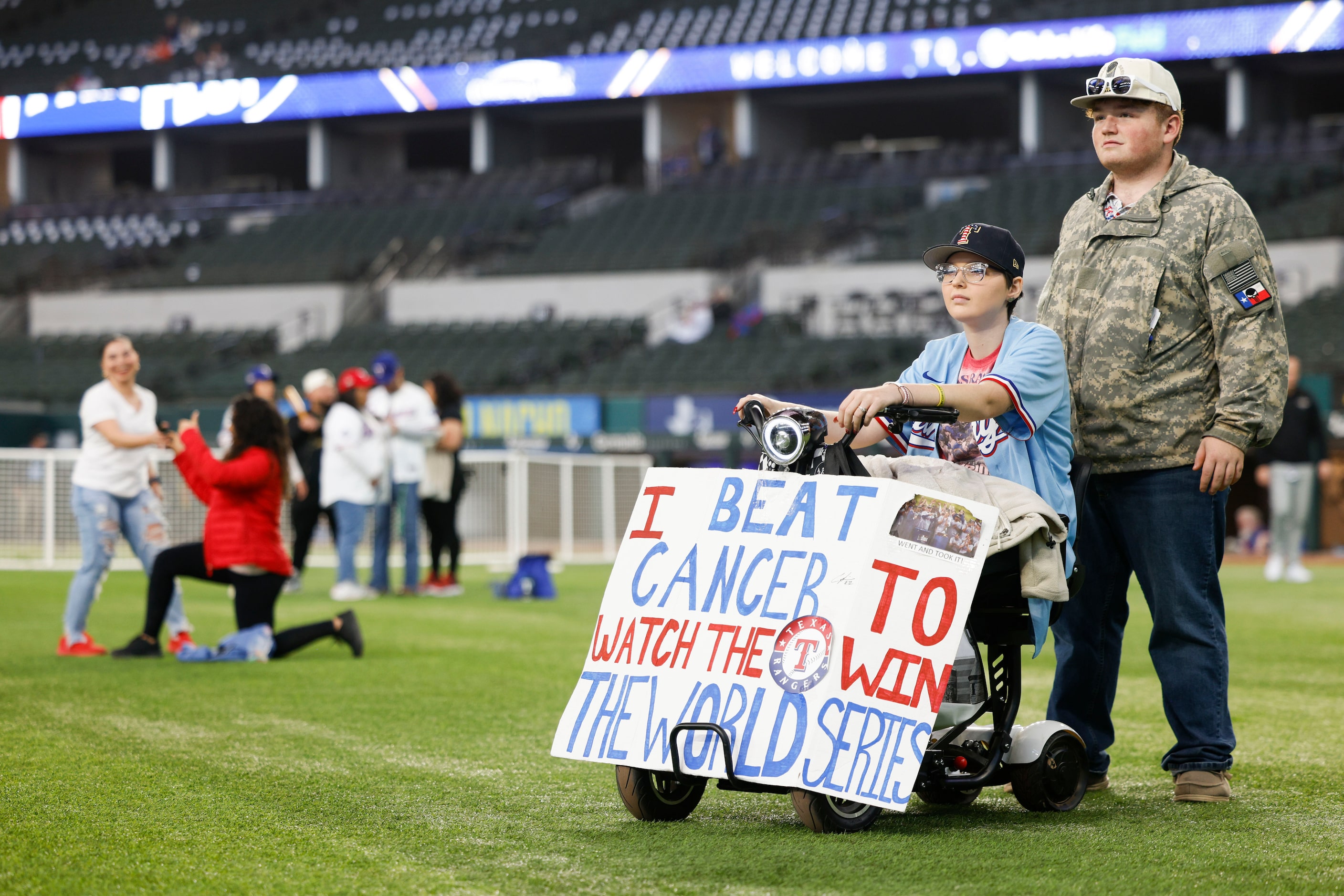 Corianna Jordan along with her brother Connor (right) watches players talk during Texas...