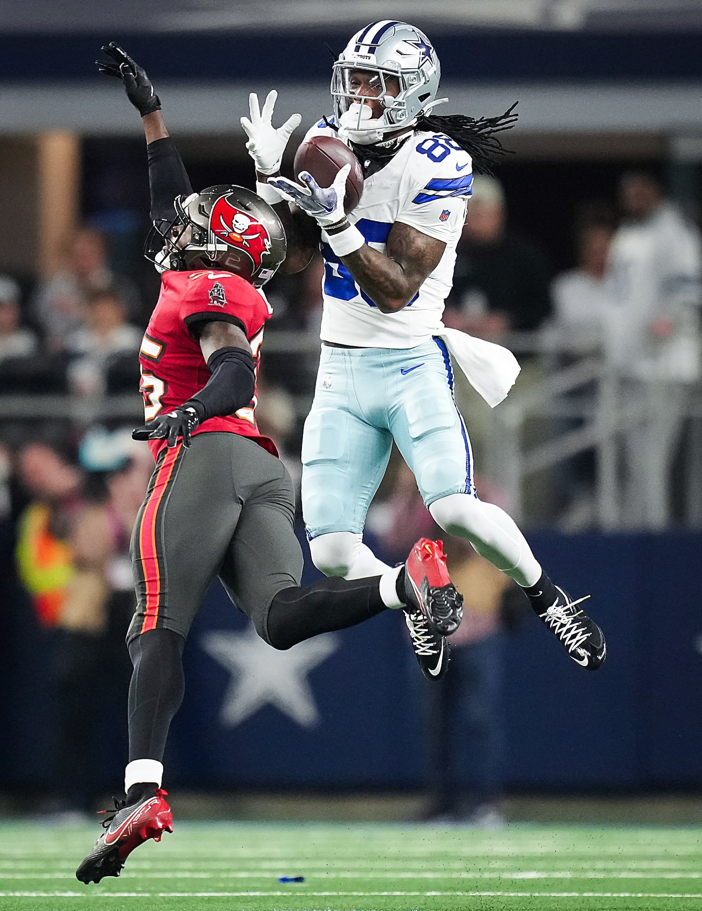 Dallas Cowboys wide receiver CeeDee Lamb (88) makes a leaping catch past Tampa Bay...