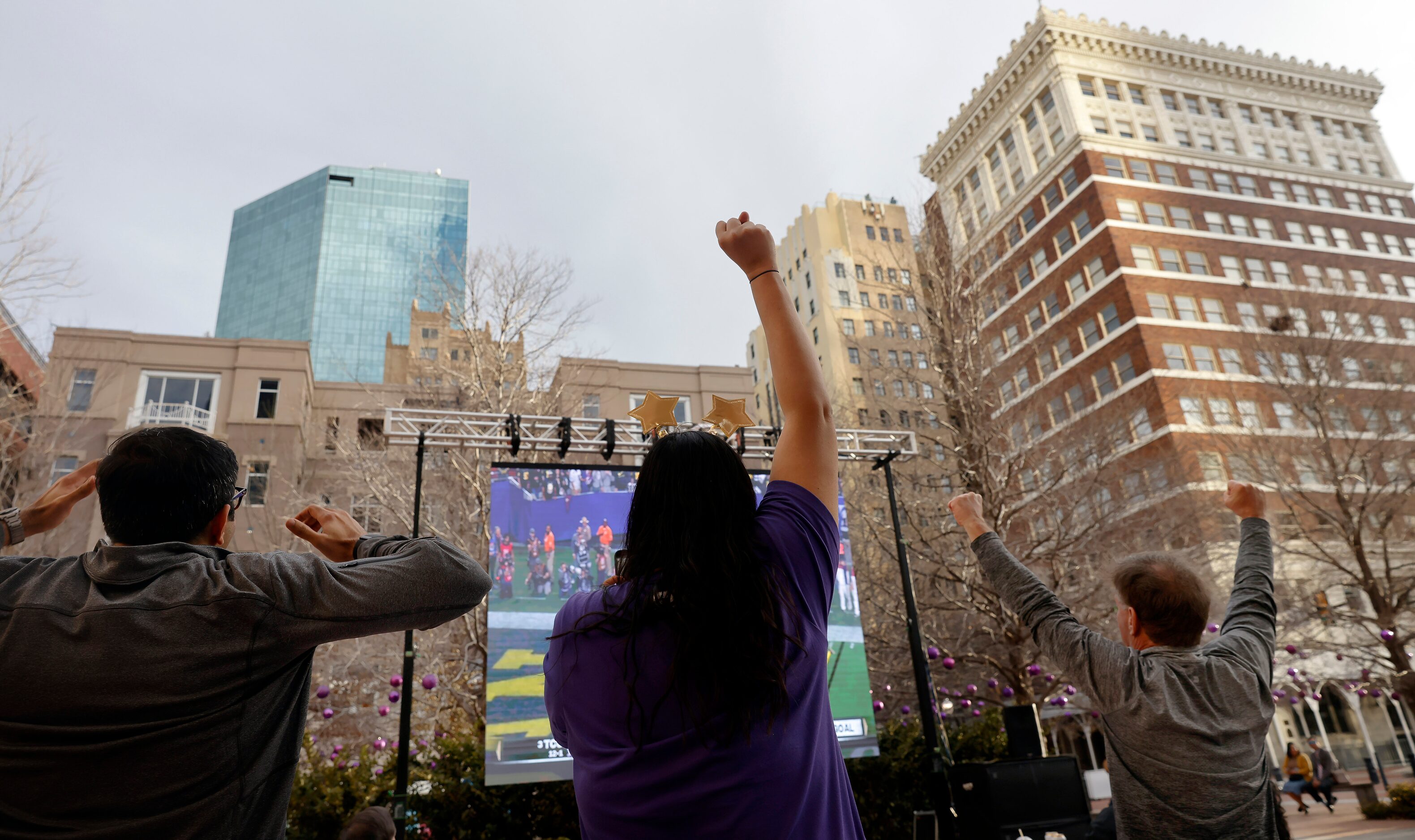 TCU Horned Frogs fans cheer a first half touchdown during an outdoor CFP watch party at...