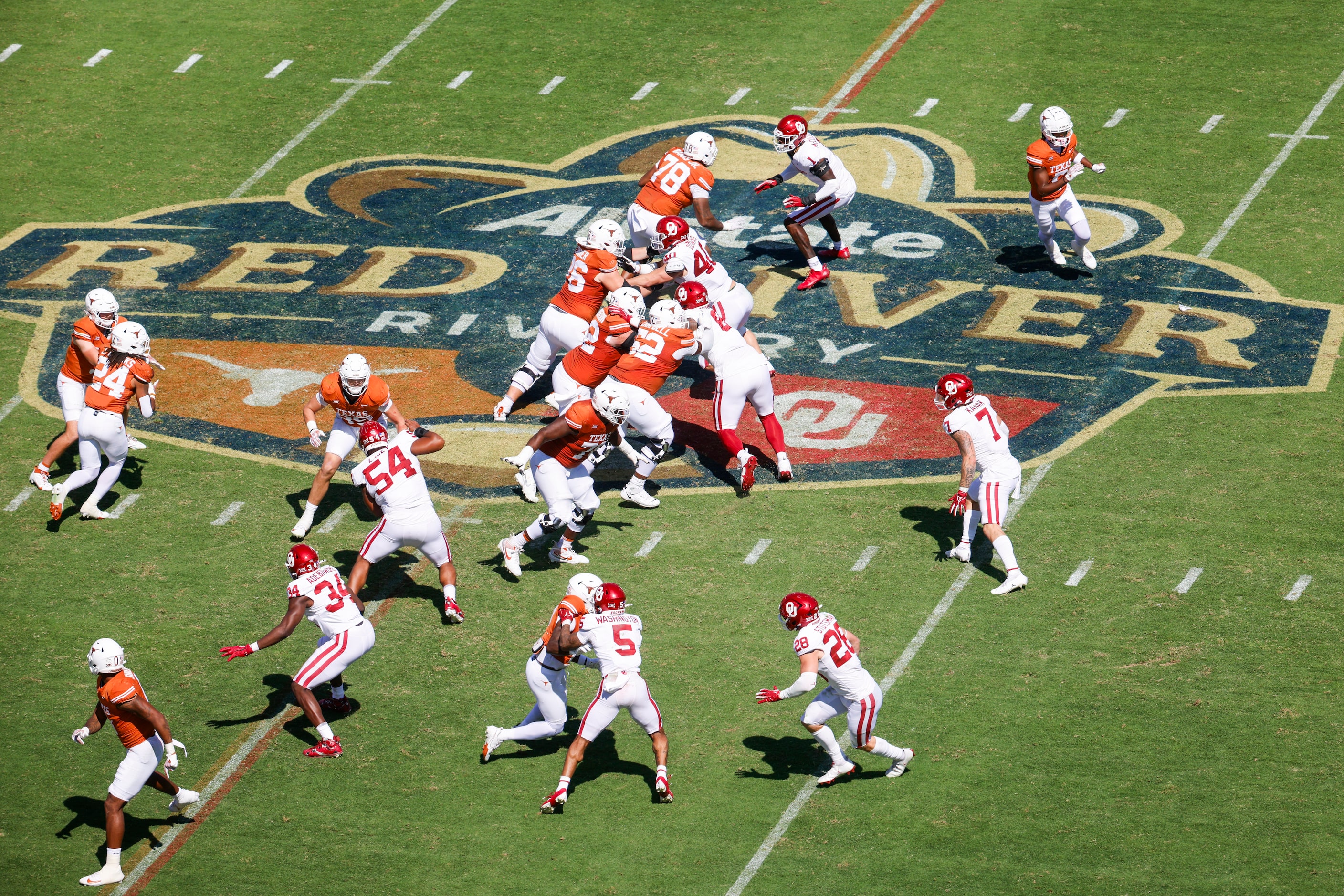 Texas compete against Oklahoma during the Red River Rivalry at the Cotton Bowl, on Saturday,...