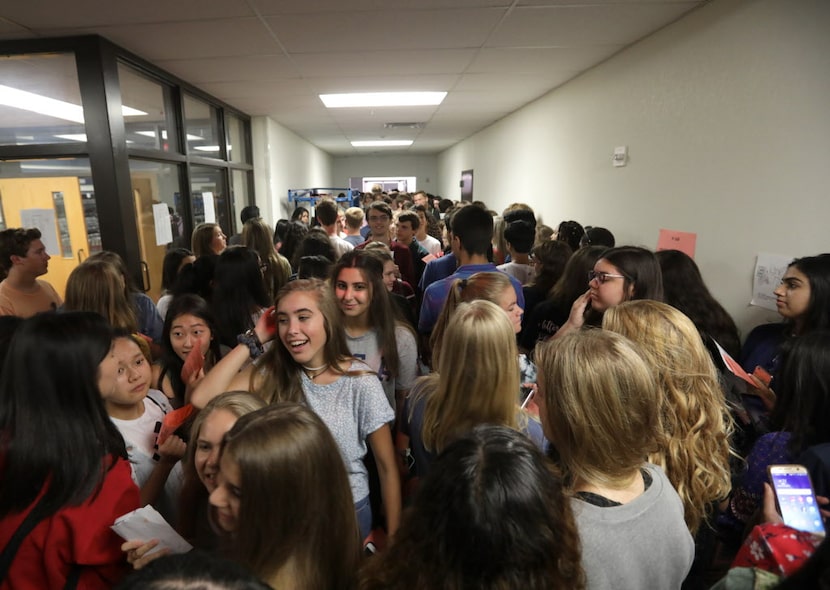 Students pick up their schedules and other back to school items at Allen ISD Performing Arts...