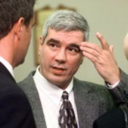  Kerry Max Cook conferred with his legal team in Bastrop in 1999.