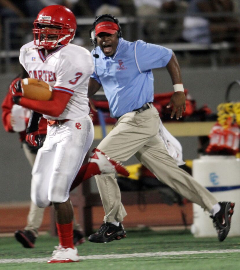 Carter Cowboys secondary coach Mickey Jones lends a lot of encouragement from the Cowboys...