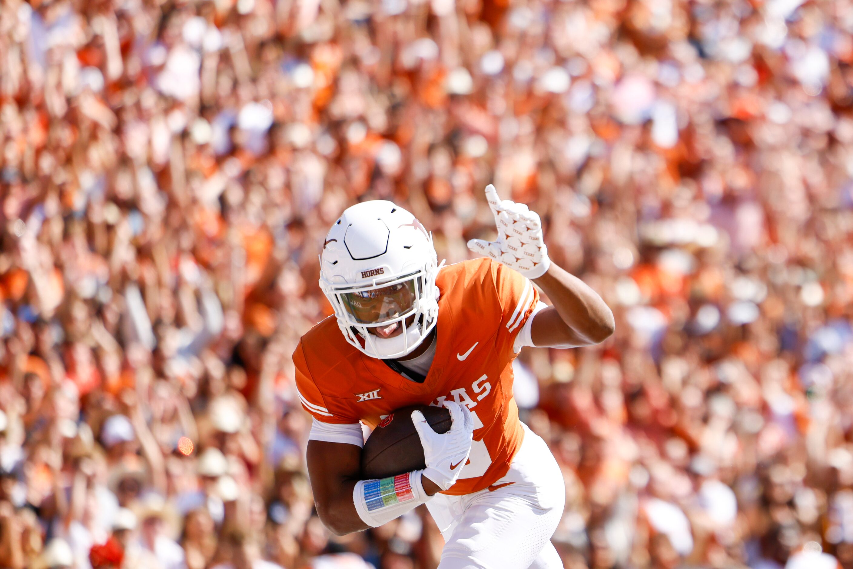 Texas defensive back Ryan Watts (left) scores a touchdown on a rebound against Oklahoma...