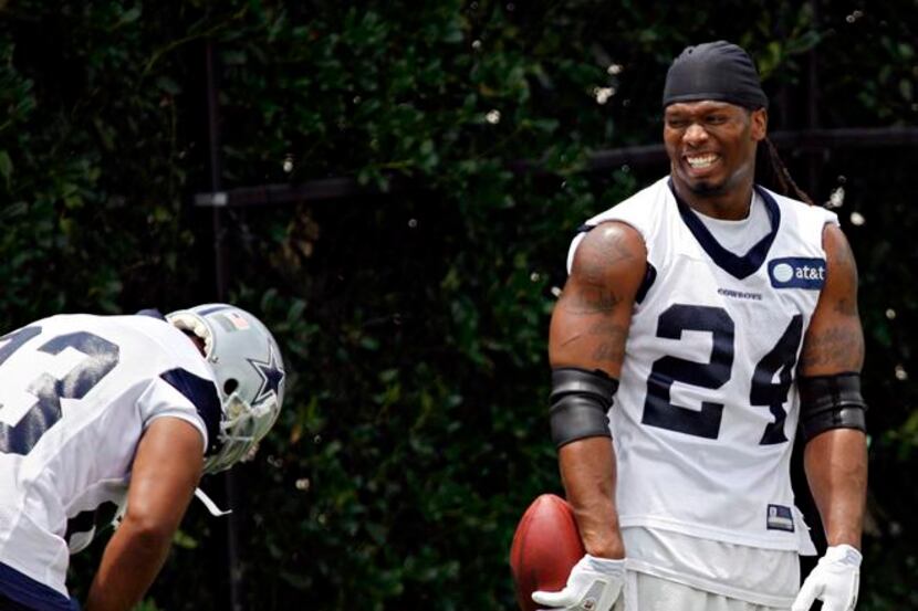 Dallas Cowboys running back Tashard Choice (23) doubles over with laughter as he jokes with...