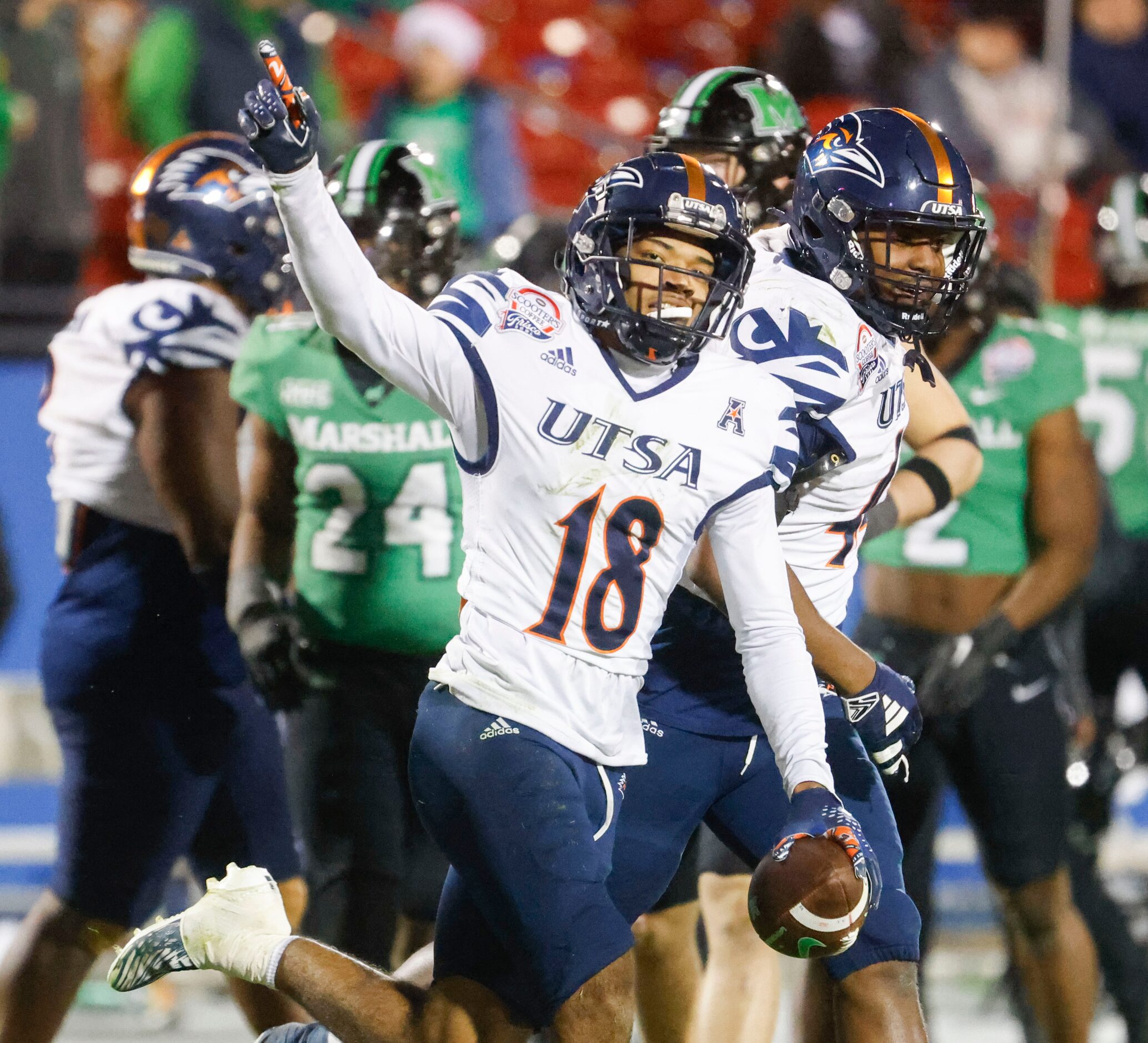 UTSA cornerback Kam Alexander celebrates after a pick six during the second half of Frisco...