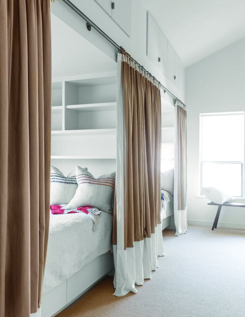 Curtains provide privacy for adults sleeping within these cozy bunks. Positioned end-to-end...