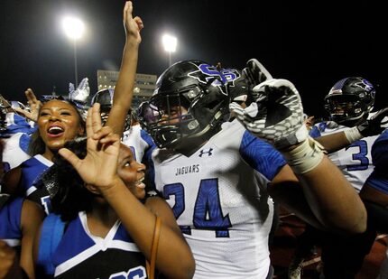 Mansfield Summit cheerleaders joined the Summit varsity team members as they celebrate their...