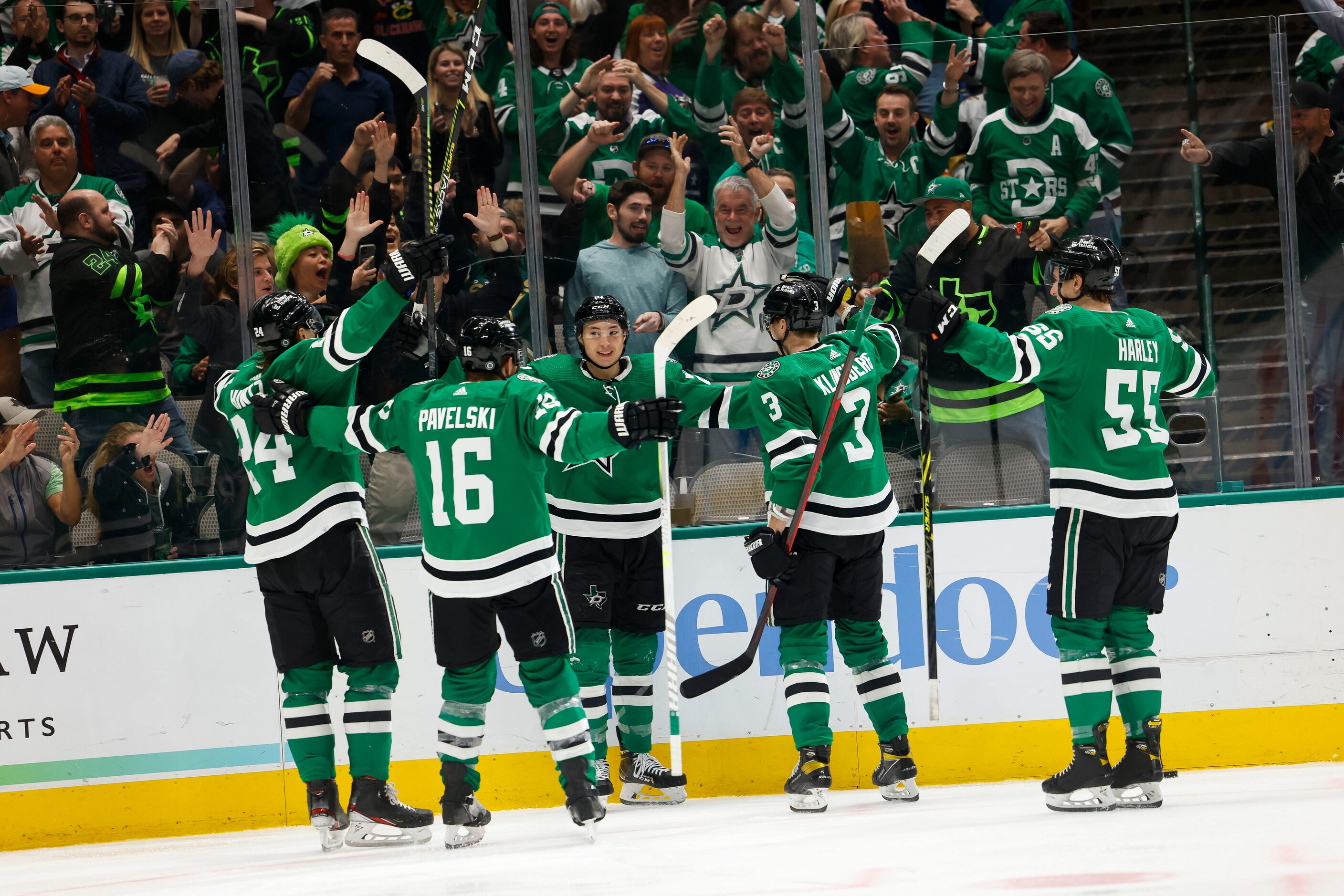 Dallas Stars left wing Jason Robertson (21) and teammates celebrate scoring against Vegas...