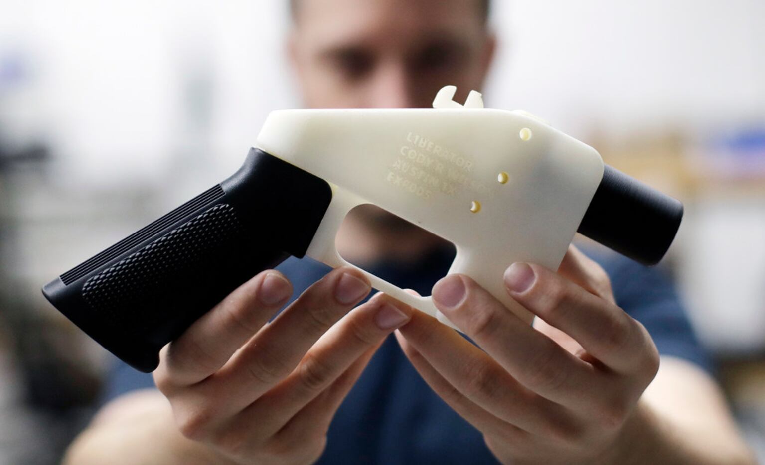 In this Aug. 1, 2018, file photo, Cody Wilson, with Defense Distributed, holds a 3D-printed...