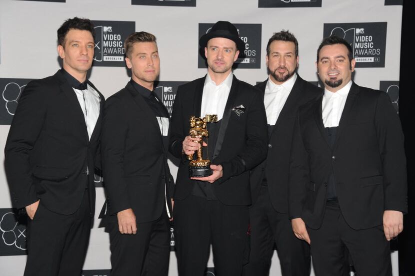FILE - In this Aug. 25, 2013, file photo, Justin Timberlake, center, winner of the video...