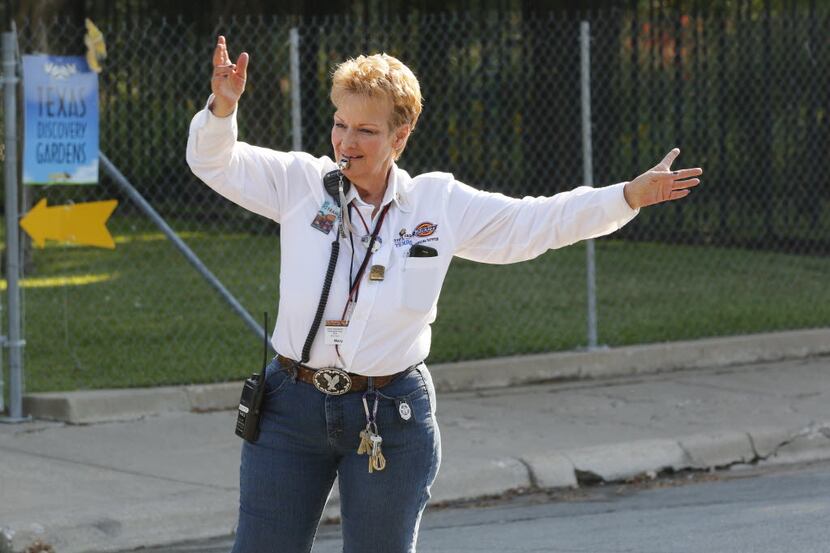 Mary Mays helps direct traffic at Gate 6 at the State Fair of Texas on Thursday, October 8,...