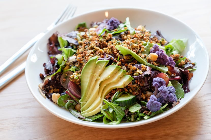 Falaf salad of mixt greens, house-baked falafel crumbles, roasted cauliflower, avocado, red...
