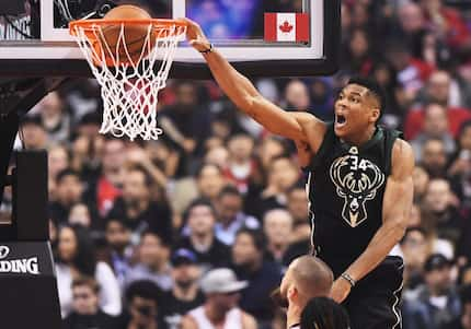 Milwaukee Bucks forward Giannis Antetokounmpo dunks against the Toronto Raptors during the...