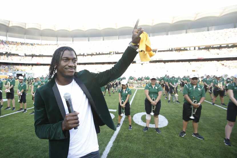 Former Baylor Bears quarterback Robert Griffin III acknowledges the crowd before the start...