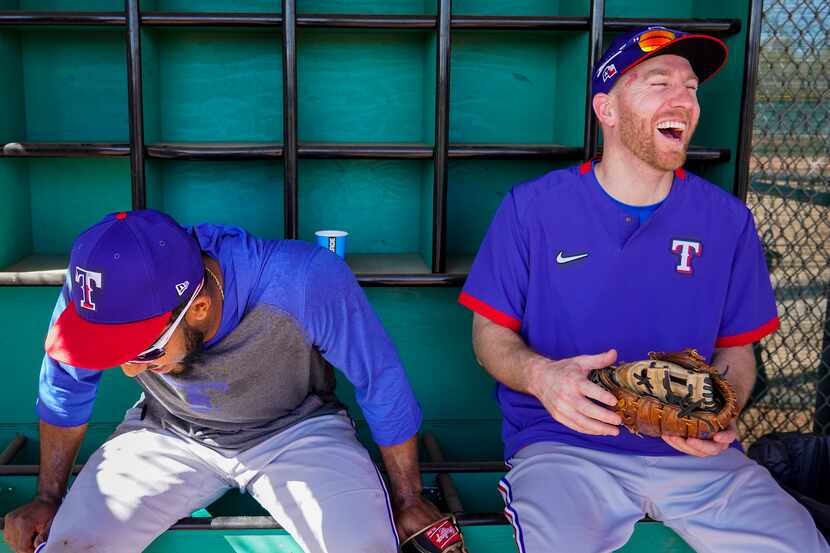 Texas Rangers shortstop Elvis Andrus (left) laughs with third baseman Todd Frazier in a...