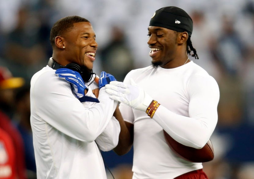 Dallas Cowboys wide receiver Terrance Williams, left, and Washington Redskins quarterback...