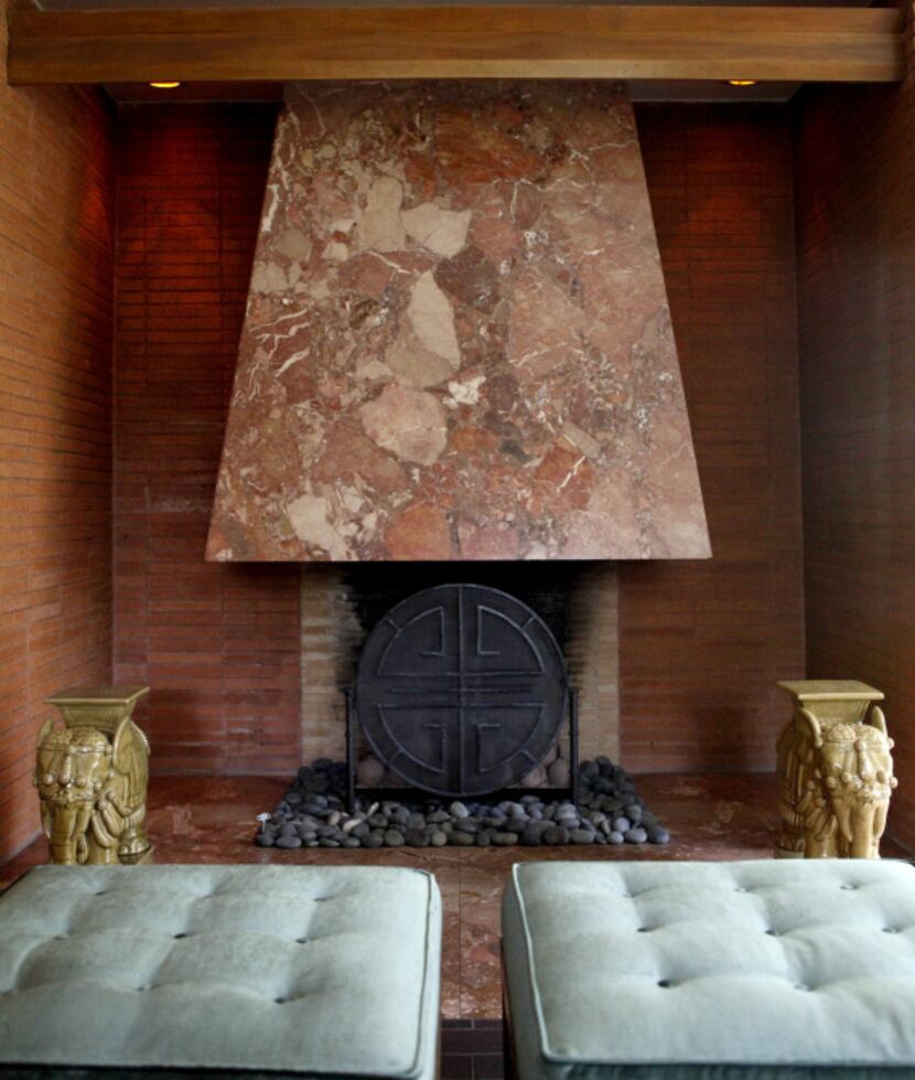 The hearth in the living room is flush with the floor. It features the same marble as the hood.