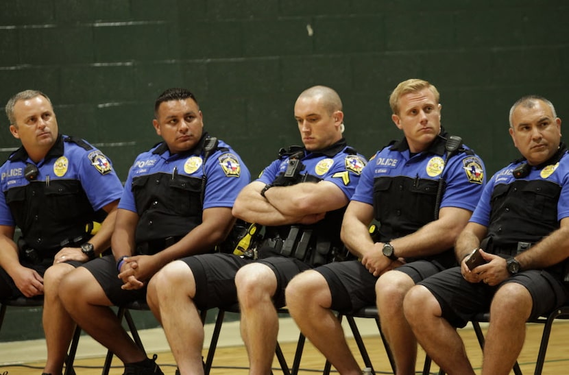 McKinney police officers listened during a community forum at Old Settler's Recreation...