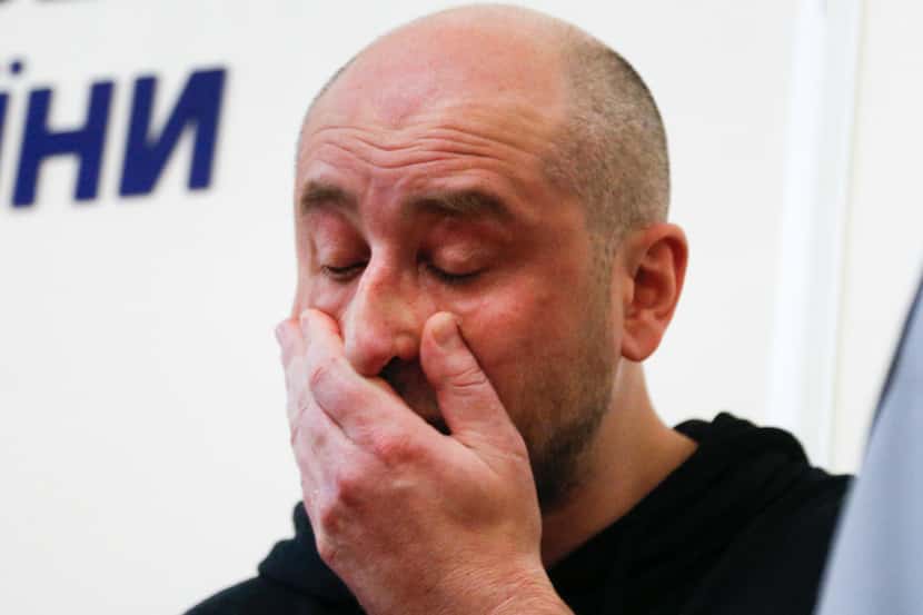 Russian journalist Arkady Babchenko reacts during a news conference at the Ukrainian...