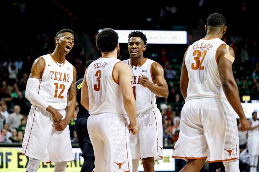 Feb 1, 2016; Waco, TX, USA; Texas Longhorns guard Kerwin Roach Jr. (12) and guard Javan...