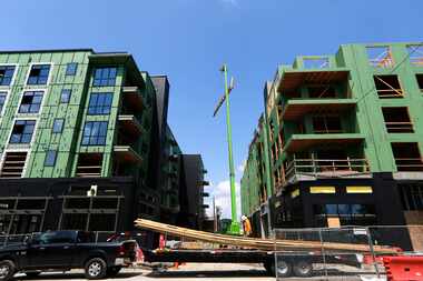 One of the apartment complexes under construction in Plano in September 2018. High-density...