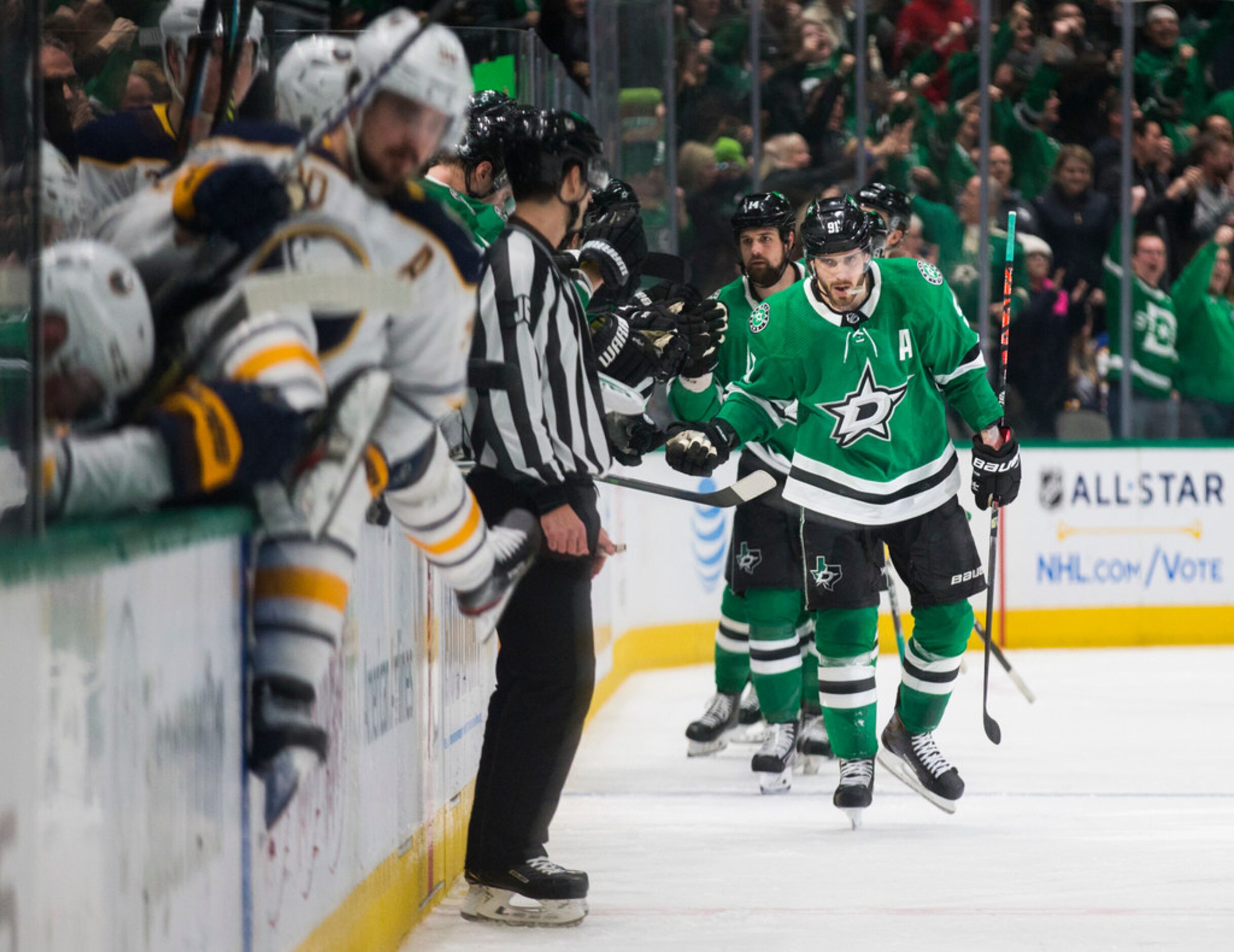 Dallas Stars center Tyler Seguin (91) and other players celebrate a goal by Dallas Stars...