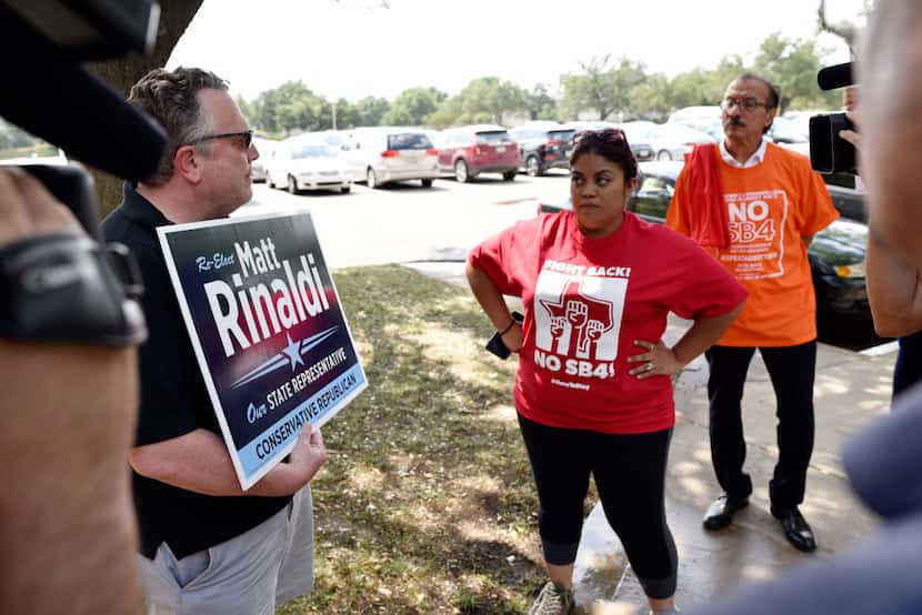 Ron Hansen, left, a supporter of State Rep. Matt Rinaldi, R-Irving, stands with a campaign...