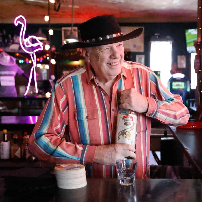 Tom Garrison (pictured) prepares a drink at his bar in Dallas. He's owned the Stoneleigh P...