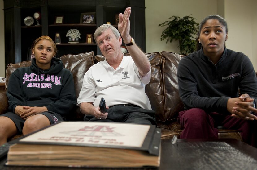 Texas A&M women's basketball coach Gary Blair, center, goes over a game film with Sydney...