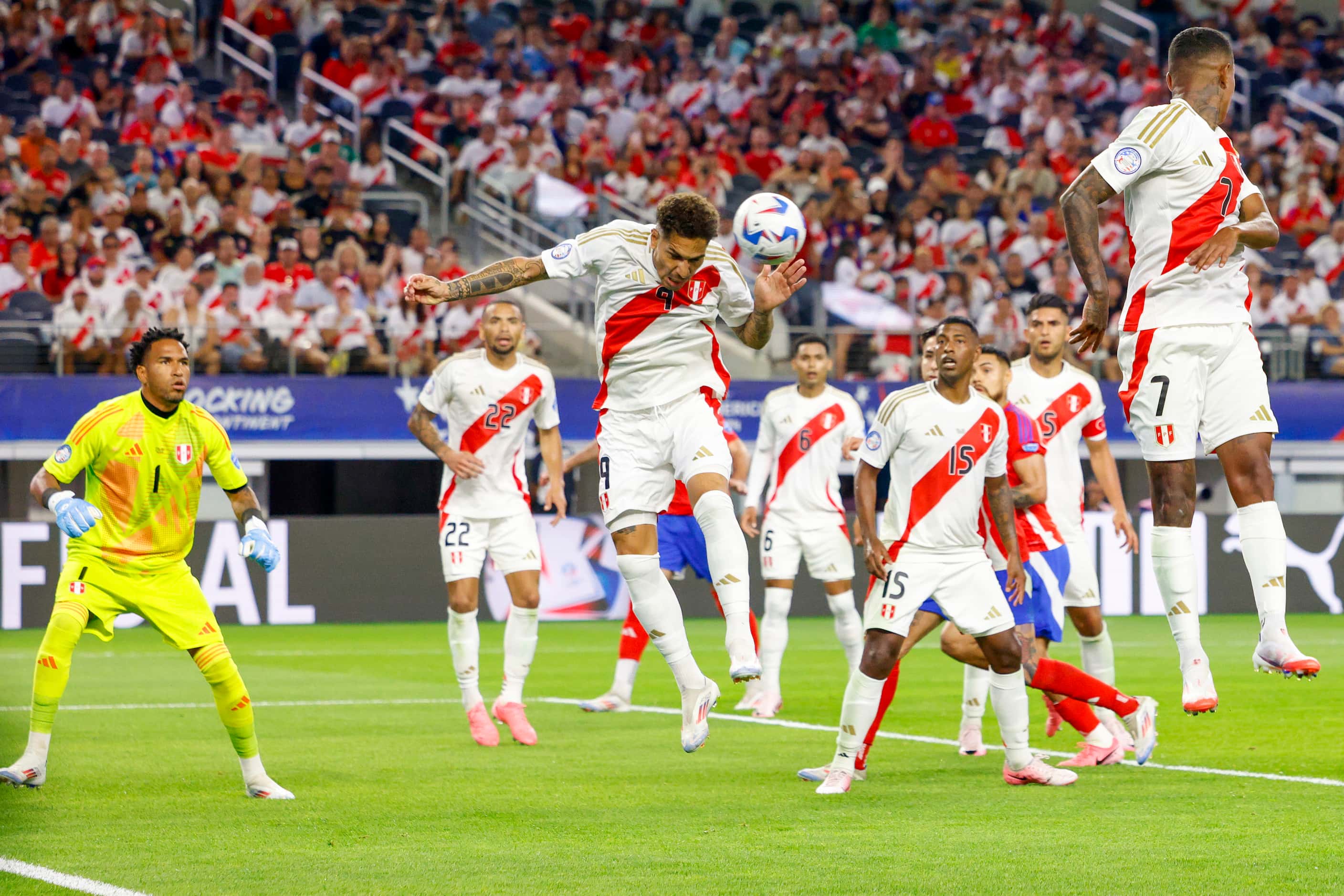 Peru forward José Paolo Guerrero (9) clears the ball after a corner kick during the second...