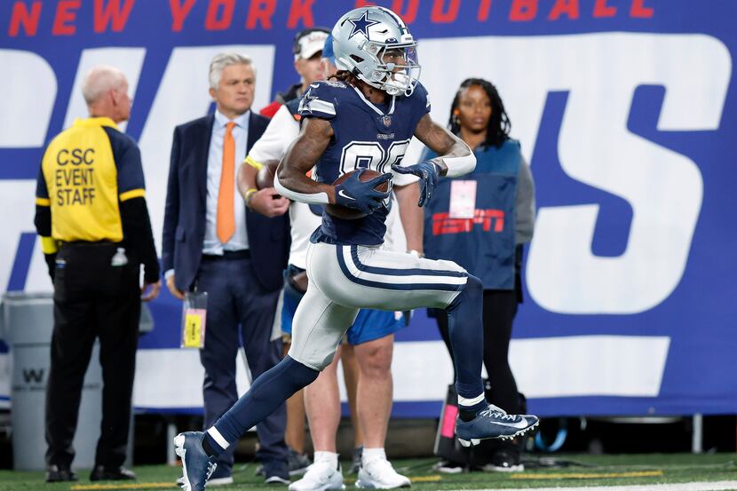 Dallas Cowboys wide receiver CeeDee Lamb (88) cruises down the sideline after making a...