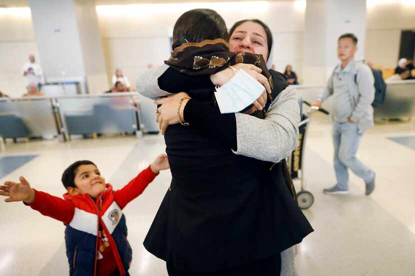 Latifa Sharifi (right), a prominent Afghan women's rights lawyer, is overcome with emotion...