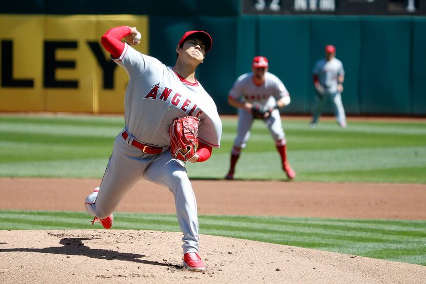 Los Angeles Angels starting pitcher Shohei Ohtani (17) throws in the first inning of his MLB...