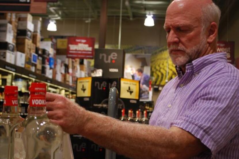 Mike O’Reilly of Dallas peruses the selection at Total Wine & More near Park Lane in Dallas....