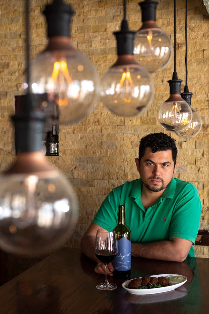 Chef and owner Sirzat Demir of Selda Mediterranean Grill in Dallas, and a dish of falafel,...