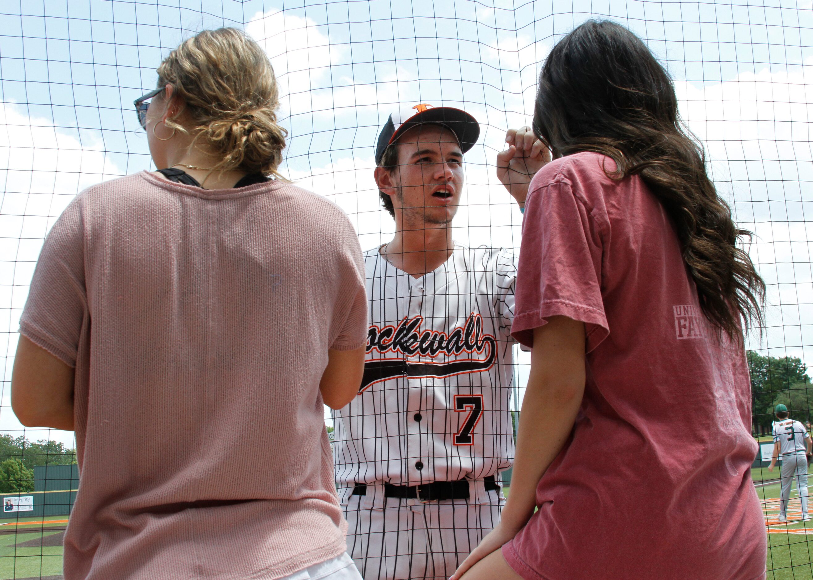 Rockwell's Daniel Cunningham (7) visits with fans Anna Brooks, left, and Avery Bendetto...