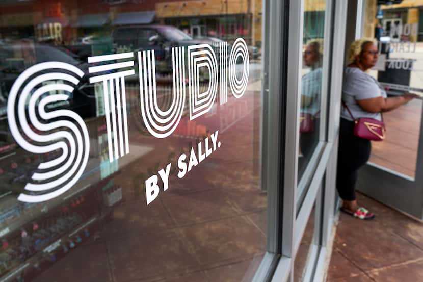 A customer exits Studio by Sally in Denton. The new concept from retailer Sally Beauty...