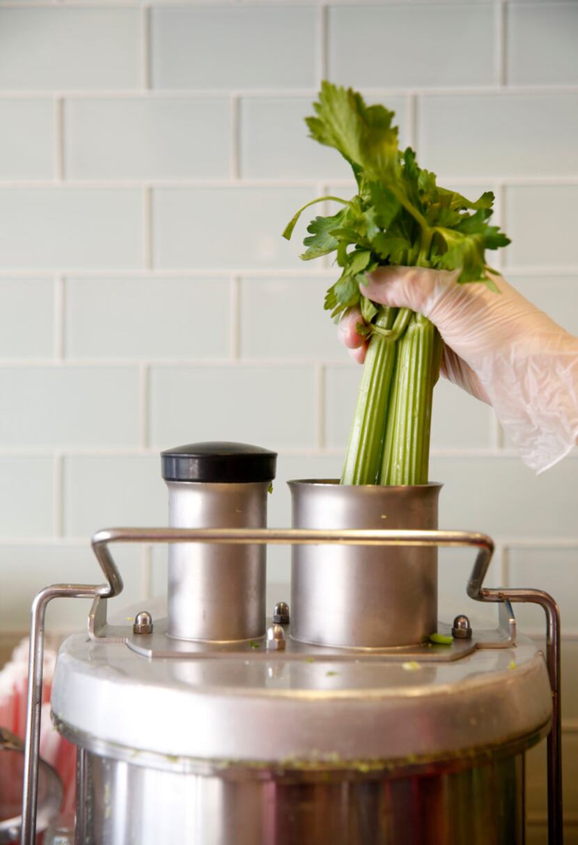 Celery is put inside a juicer at The GEM in Dallas 
