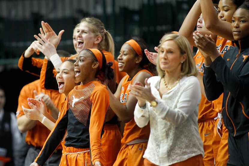 The Texas Longhorns bench begins to celebrate their upset win over the Oklahoma Sooners in...