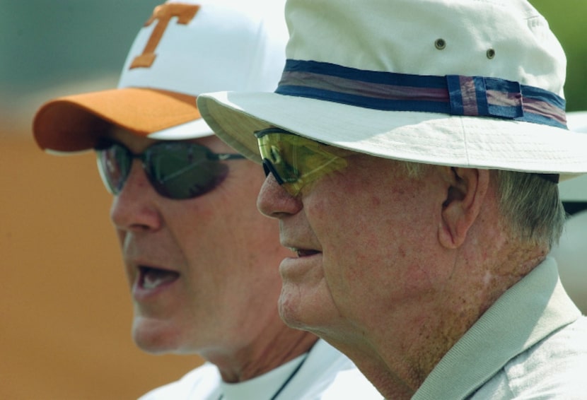 University of Texas head football coach Mack Brown, left, and former coach Darrell Royal,...