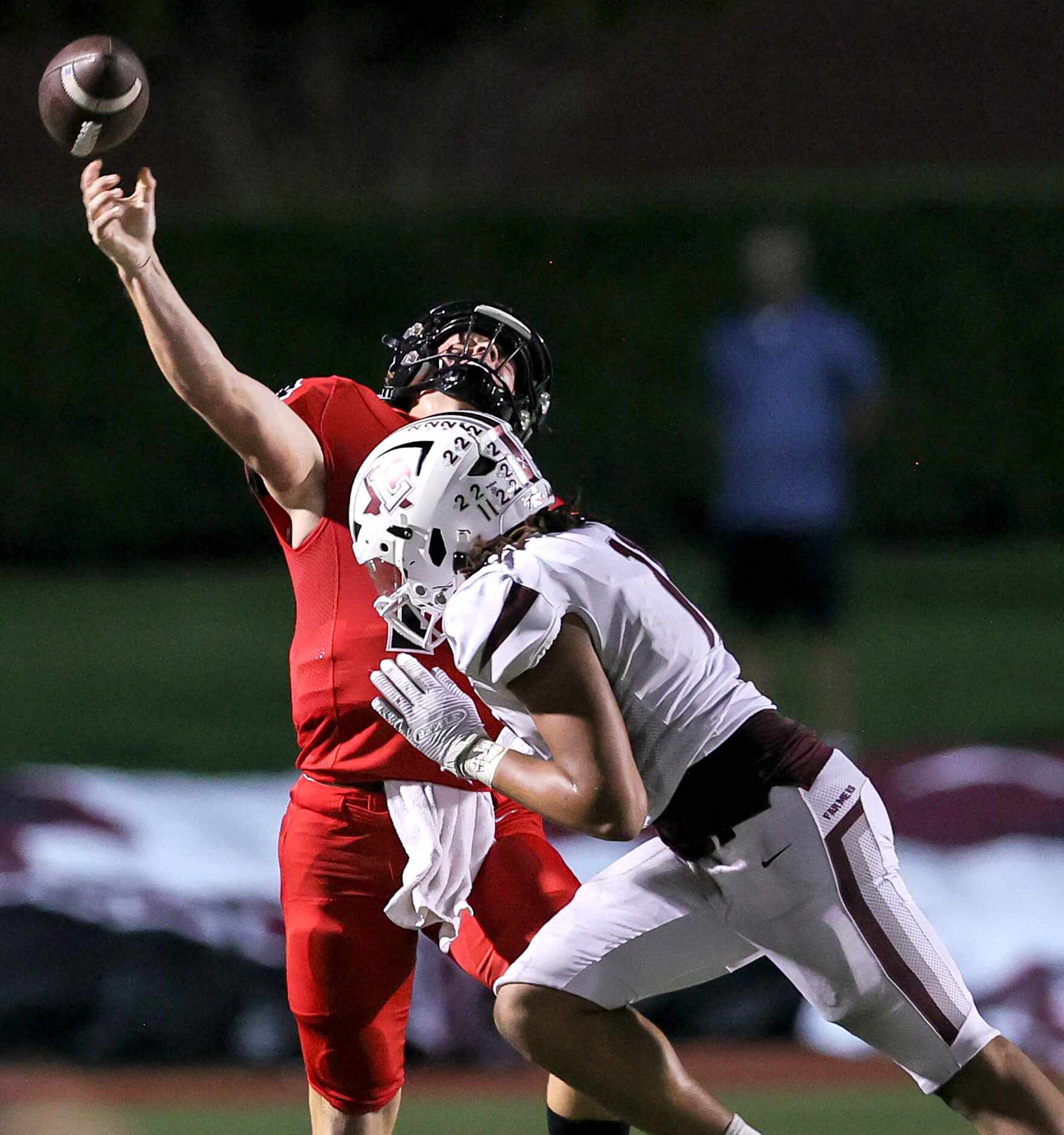 Coppell quarterback Edward Griffin gets off a pass as he pressured by Lewisville defenisve...