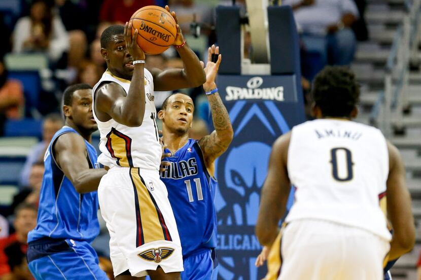 Dec 4, 2013; New Orleans, LA, USA; New Orleans Pelicans point guard Jrue Holiday (11) passes...